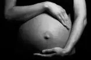 Pregnant women holding her belly