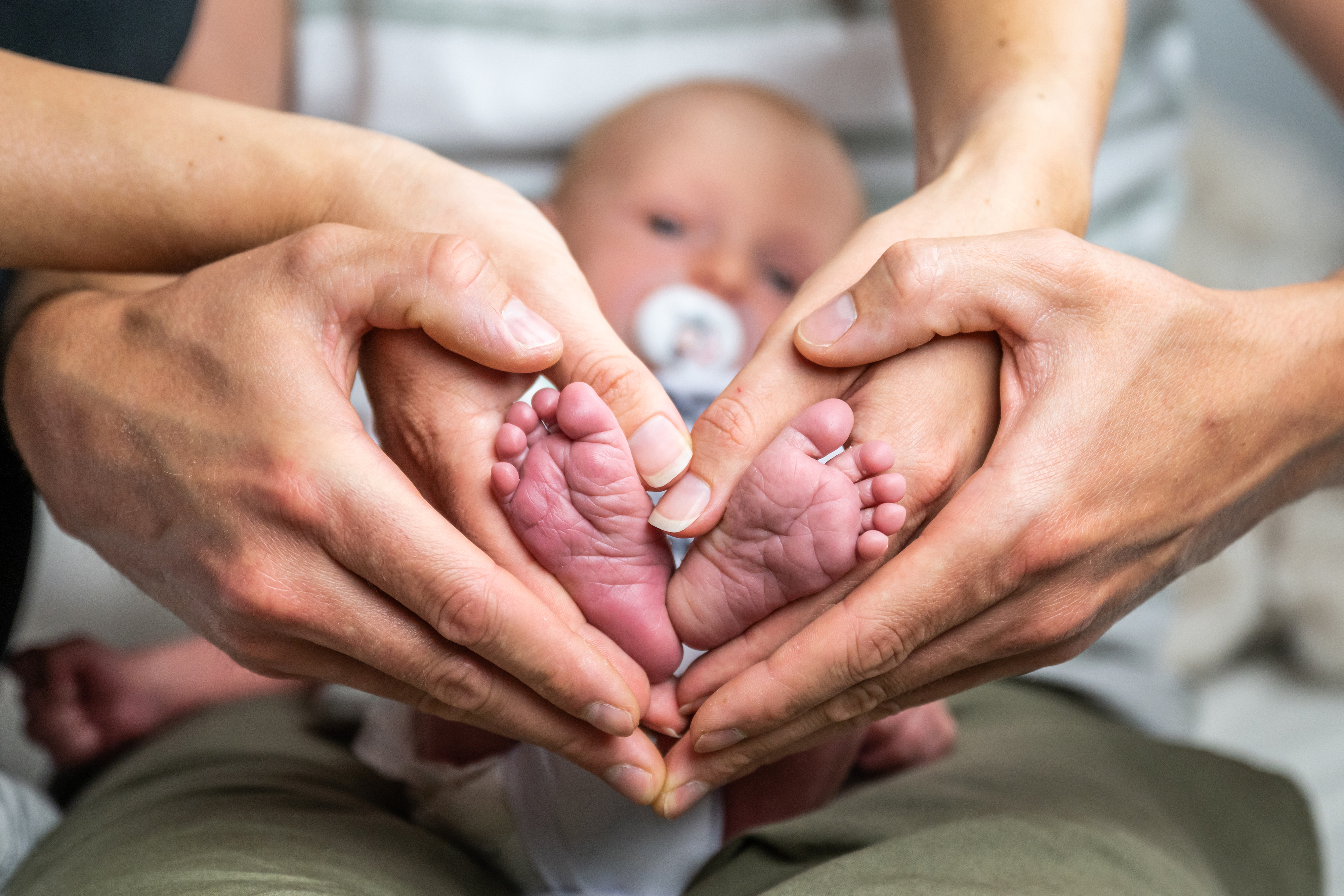 Parents holding their newborn baby