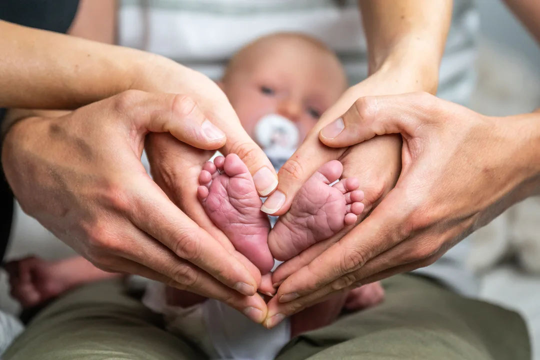 Parents holding their newborn baby